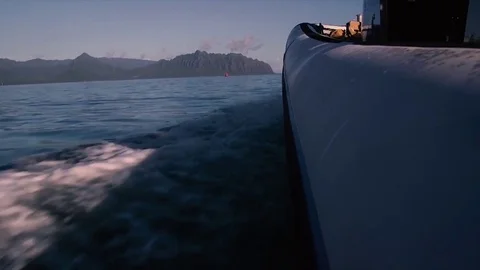 View from side of inflatable boat moving through water Видео 84256951