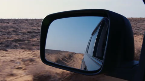 View of side mirror of car, reflecting road behind Stock-Footage 170132150