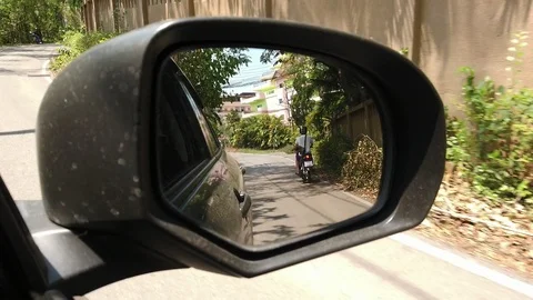 View of side mirror, driving passes along the road. Stock Footage 110507040