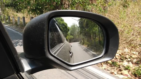 View of side mirror, driving passes along the road. Stock Footage 113102426