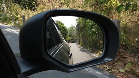 View of side mirror, driving passes along the road. Stock Footage 119884069