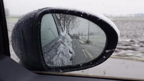 A view from side mirror with snow. Stock Footage 342938630