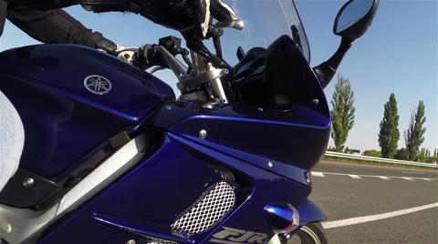 View from the side of the motorcycle in motion. Stock Footage 55317074