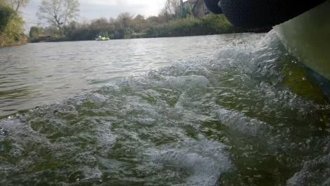 View from side of moving boat wave. Stock Photos