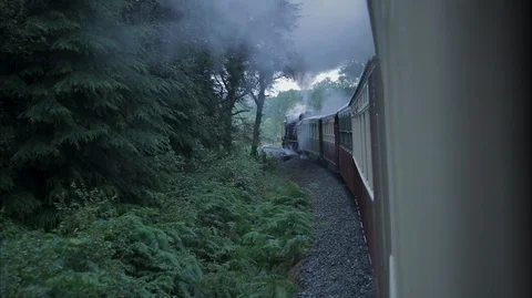 View from the side of a moving vintage steam train carriage Stock Footage 128360741