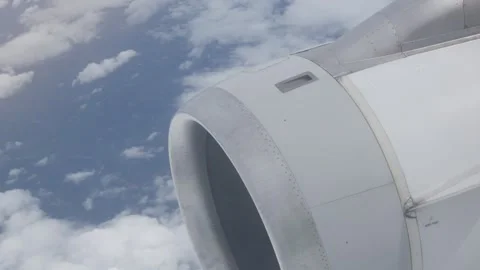 View from in side plane cabin through plane window see plane's engine Video stock 258749525