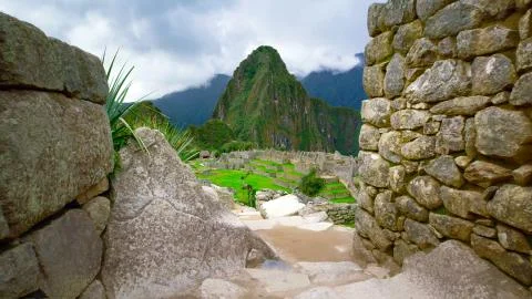 View from the side of the stone walls of Machu Picchu Stock Photos