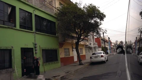 View of side streets while driving through Mexico City 스톡 동영상 129395429
