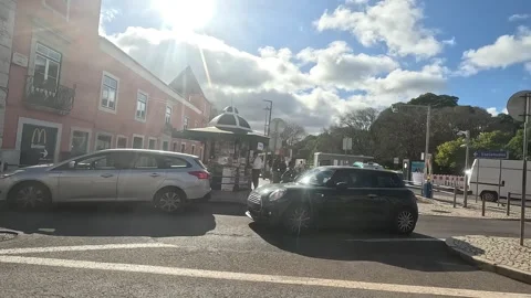 View from side window of historic tram moving through narrow streets of Lisbon Stock Footage 324814482