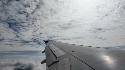 View from side window of plane. Stockbeeldmateriaal 311492648
