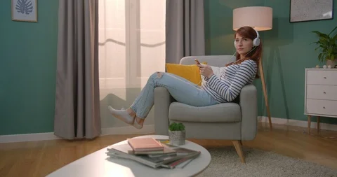 View from the side on the young red-haired good looking young woman in Stock Footage 122498681