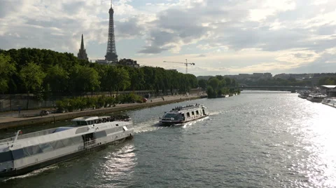View of sightseeing boats floating on Seine River near Eiffel Tower, Paris Stock Footage 59964561