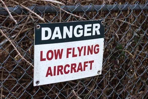 View of sign Caution Low Flying Aircraft at local airport in Courtenay Stock Photos