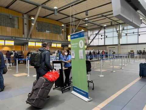 View of sign Covid-19 Testing by CVM Medical at Vancouver Airport Stock Photos