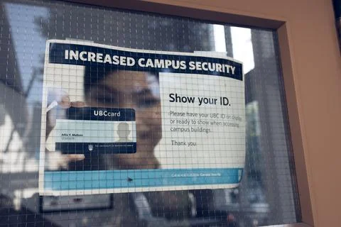 View of sign Increased Campus Security at one of the building at UBC Stock Photos
