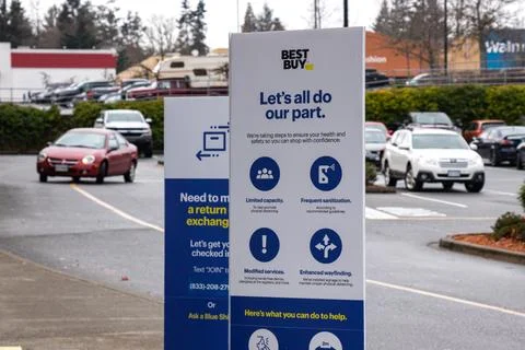View of sign Lets all do our part at the entrance of Best Buy Store Stock Photos