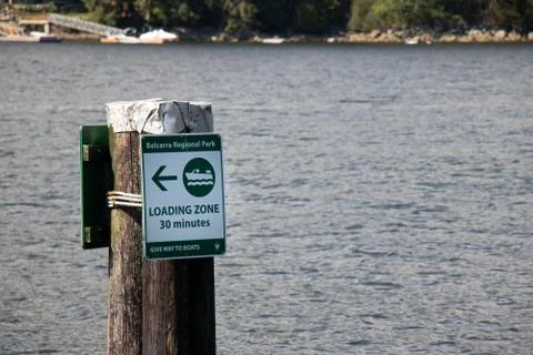 View of sign "Loading zone 30 minutes" on a pier in Belcarra Regional Park Stock Photos