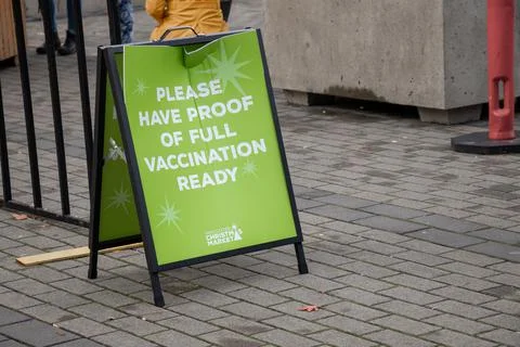View of sign Please Have Proof of Full Vaccination Ready Stock Photos