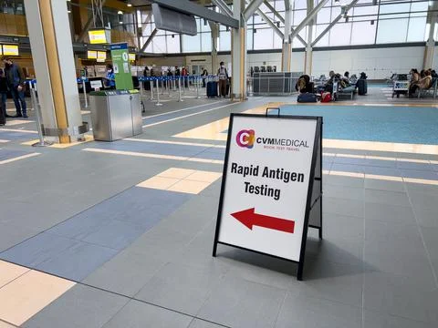 View of sign Rapid Antigen Testing by CVM Medical at Vancouver Airport Stock Photos