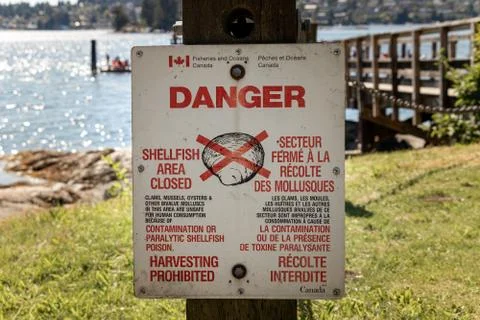 View of sign "Shellfish area closed, harvesting prohibited" Stock Photos