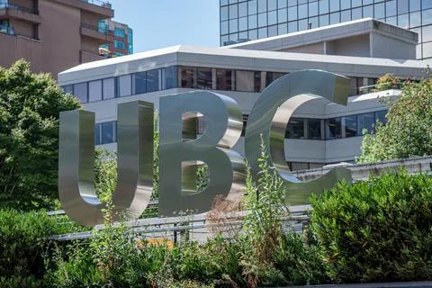 View of sign UBC Robson Square in Downtown Vancouver. Sunny day. Stock Photos
