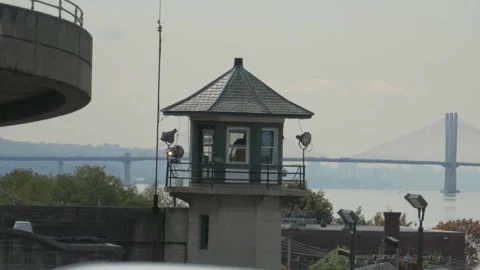 View of Sing Sing Prison Watch Tower with Tapan Zee Bridge in the distance Stock Footage 253959348