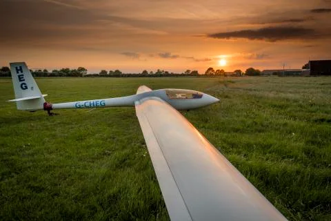 View of a single seat glider with setting sun at Kirton in Lindsey Airfield,  Stock Photos
