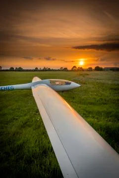 View of a single seat glider with setting sun at Kirton in Lindsey Airfield,  Stock Photos