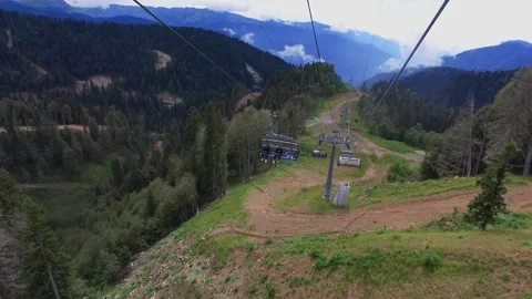 View from the ski lift in the mountains. Cable car ride. Beautiful landscape Video stock 166066694