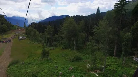 View from the ski lift in the mountains. Cable car ride. Beautiful landscape Stock Footage 166066811