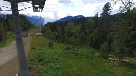 View from the ski lift in the mountains. Cable car ride. Beautiful landscape Stock Footage 166118115