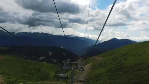 View from the ski lift in the mountains. Cable car ride. Beautiful landscape Stock Footage 166379855