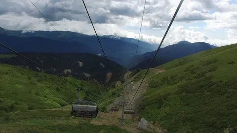 View from the ski lift in the mountains. Cable car ride. Beautiful landscape Stock Footage 168437832