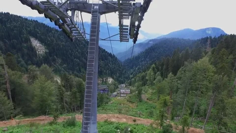 View from the ski lift in the mountains. Cable car ride. Beautiful landscape Video stock 168437935