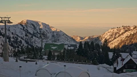 View of the ski resort, funiculars are coming, hotels are below Stock-Footage 241924377