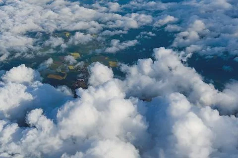View of the sky above the clouds. blue sky high view from airplane window clouds Stock Photos