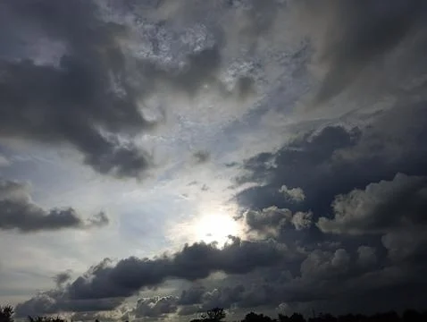 View of the sky in the afternoon when the sun will set behind the clouds Stock Photos