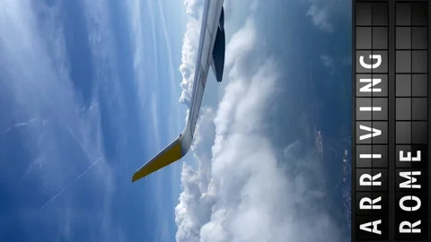 View of the sky from an airplane and a display board with arriving in Rome Stock Footage 194527357