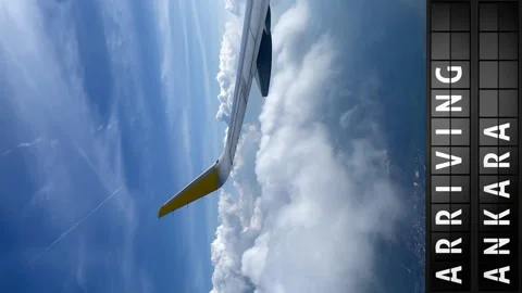 View of the sky from an airplane and a display board with arriving in Ankara Stock Footage 196867311