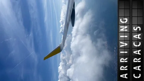 View of the sky from an airplane and a display board with arriving in Caracas Stock Footage 196867462