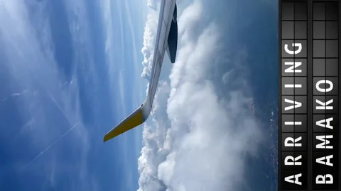 View of the sky from an airplane and a display board with arriving in Bamako Stock Footage 196868888