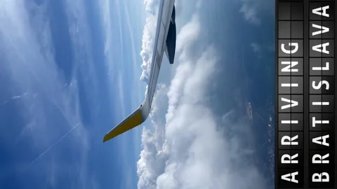 View of the sky from an airplane and a display board with arriving in Bratislava Stock Footage 197330461