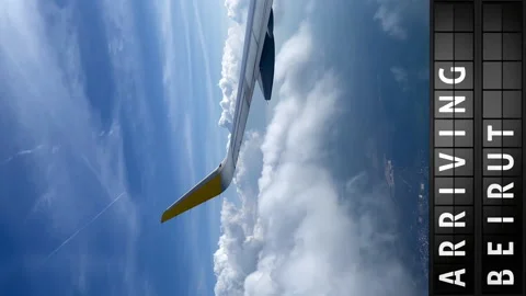 View of the sky from an airplane and a display board with arriving in Beirut Stock Footage 197331136