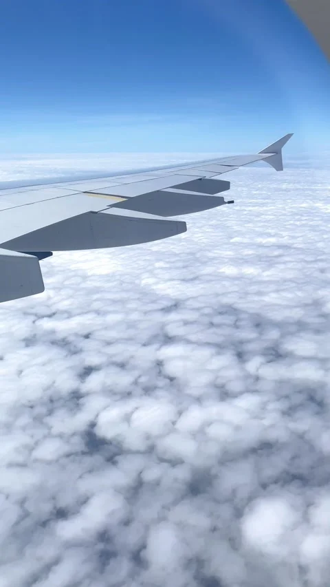 A view of the sky and clouds from an airplane window. Video stock 231473821