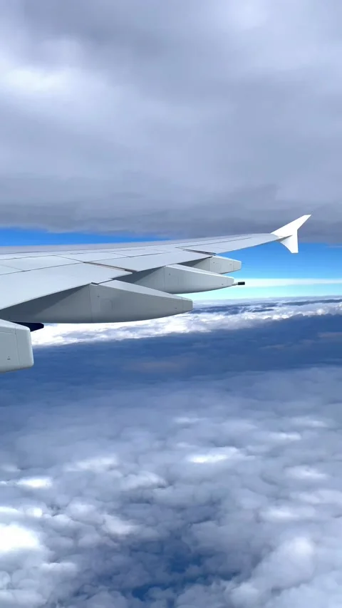 A view of the sky and clouds from an airplane window. Video stock 231474010