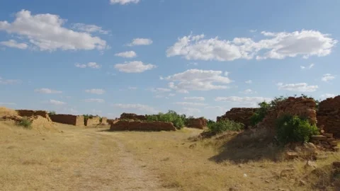 View of sky and clouds over brick walls of an abandoned village Stock Footage 220901719