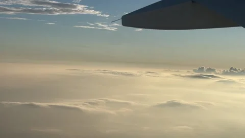 View of the Sky and Clouds from Plane Window Stock Footage 214220215