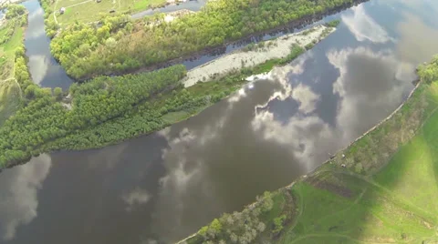 View of the sky and clouds reflected in the river. Rotation. Aerial. Stock Footage 37396432