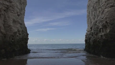 A view of the sky and the sea between white rocks. Stock Footage 75711668