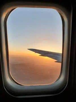 View of the sky and the wing with the iluminator of the aircraft Stock Photos